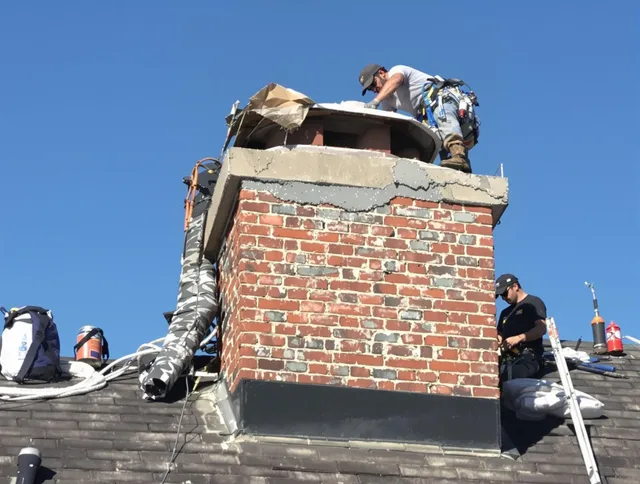 Berlin Chimney Sweep installing a custom chimney crown in Berlin, CT