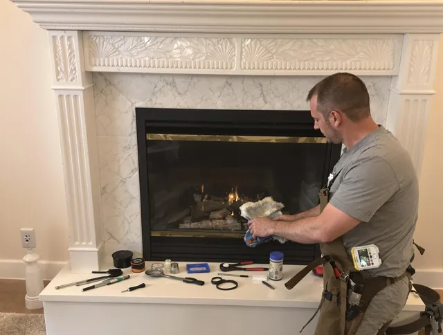 Berlin Chimney Sweep performing fireplace maintenance in Berlin, CT